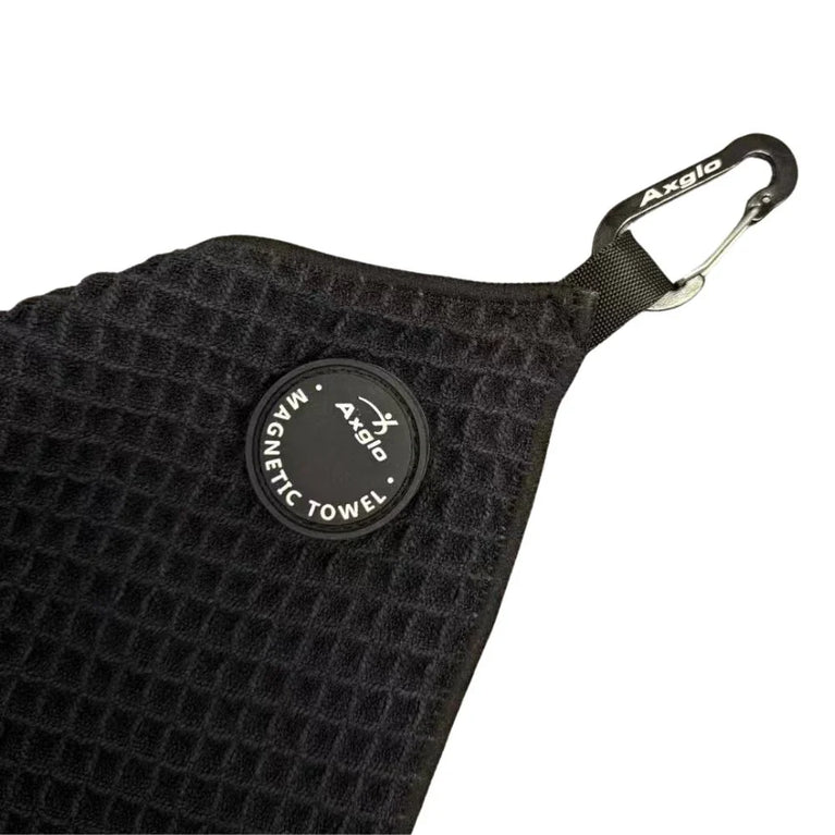 Image of black magnetic towel for golf trundler, showing magnet and carabiner